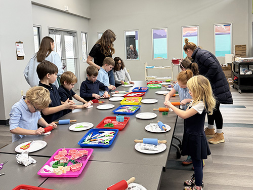 Students engaged in a fun learning activity at the Peter White Public Library!