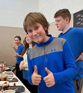Student serving ice cream