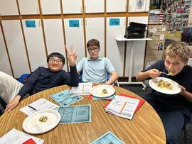 Students eating potatoes