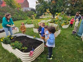 Students looking at flower beds