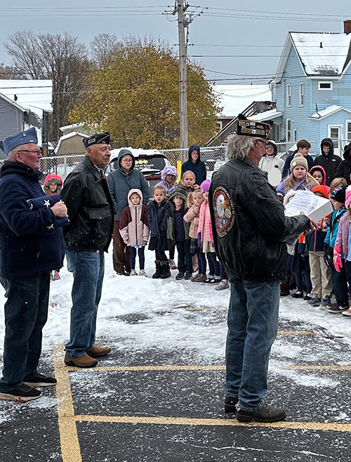 Veterans giving a speech to the crowd