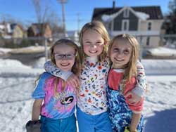 3 girls with arms around each other