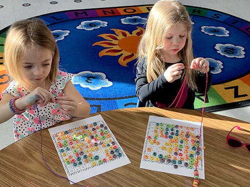 Students working with colored loops