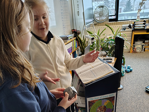 two students giving a presentation