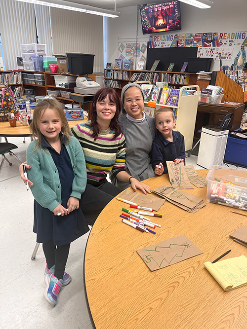 Students and teach at table
