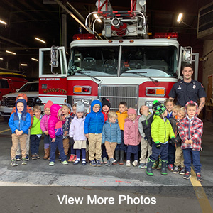 Students in front of fire truck with fireman