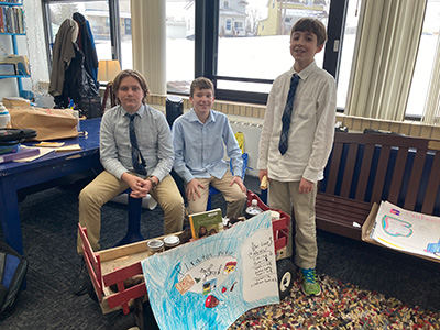 Food Truck Event Team - 3 boys with a wagon and poster display