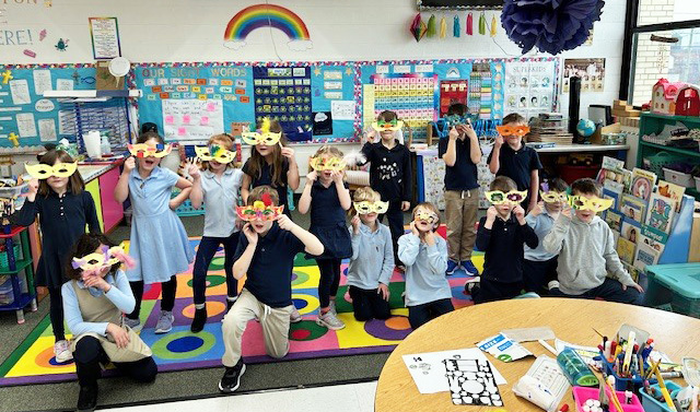 Kindergarten students enjoying Mardi Gras celebration
