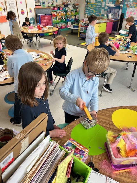 Kindergarten students engaged in learning about Mardi Gras