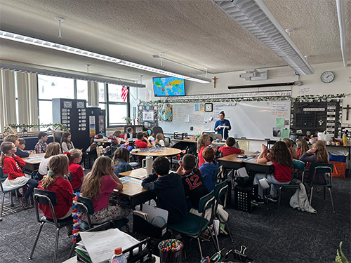 Students listening to an adult