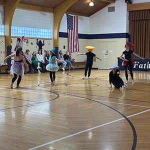 students dancing with hats and costumes on