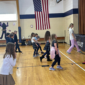 students learning dance steps