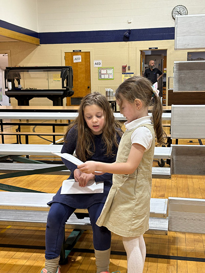 Two girls discussing their lists