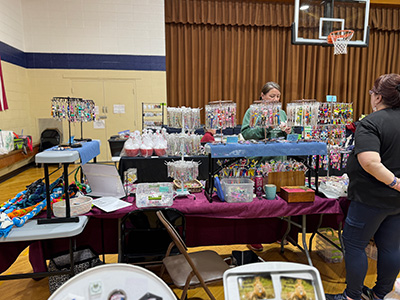 Display tables filled with items at Santa's Workshop