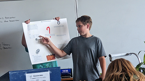 Student presenting his science project