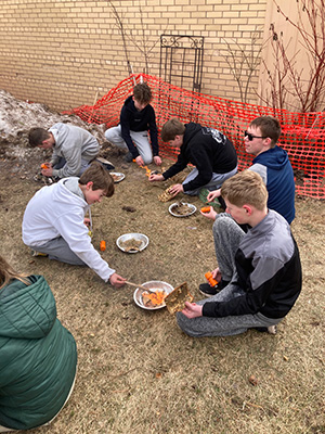 Multiple students making fires