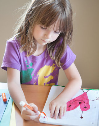 Student drawing a heart