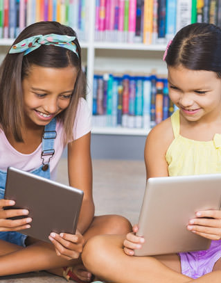 Two students looking at tablets