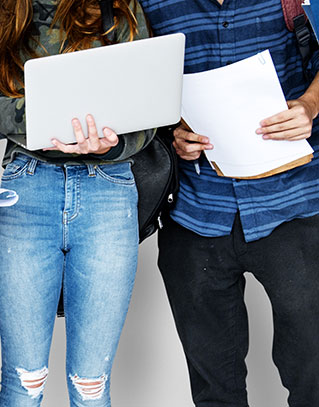 Students with a laptop and homework