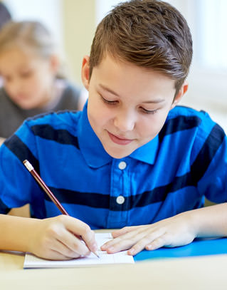 Student writing in a notebook