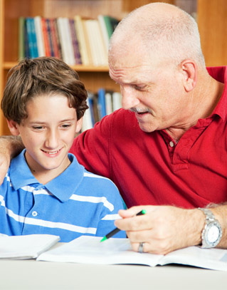 Adult helping a student do homework