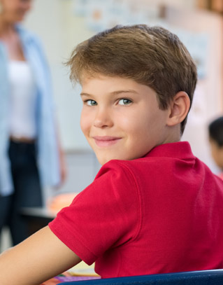 Smiling student looking over his shoulder