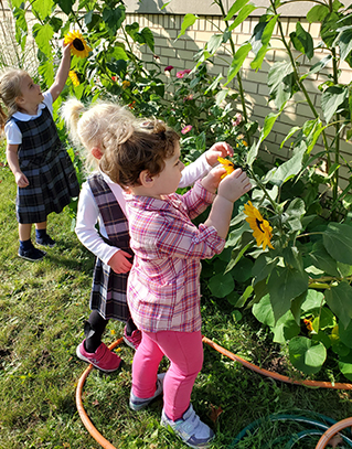 Children with sunflowers